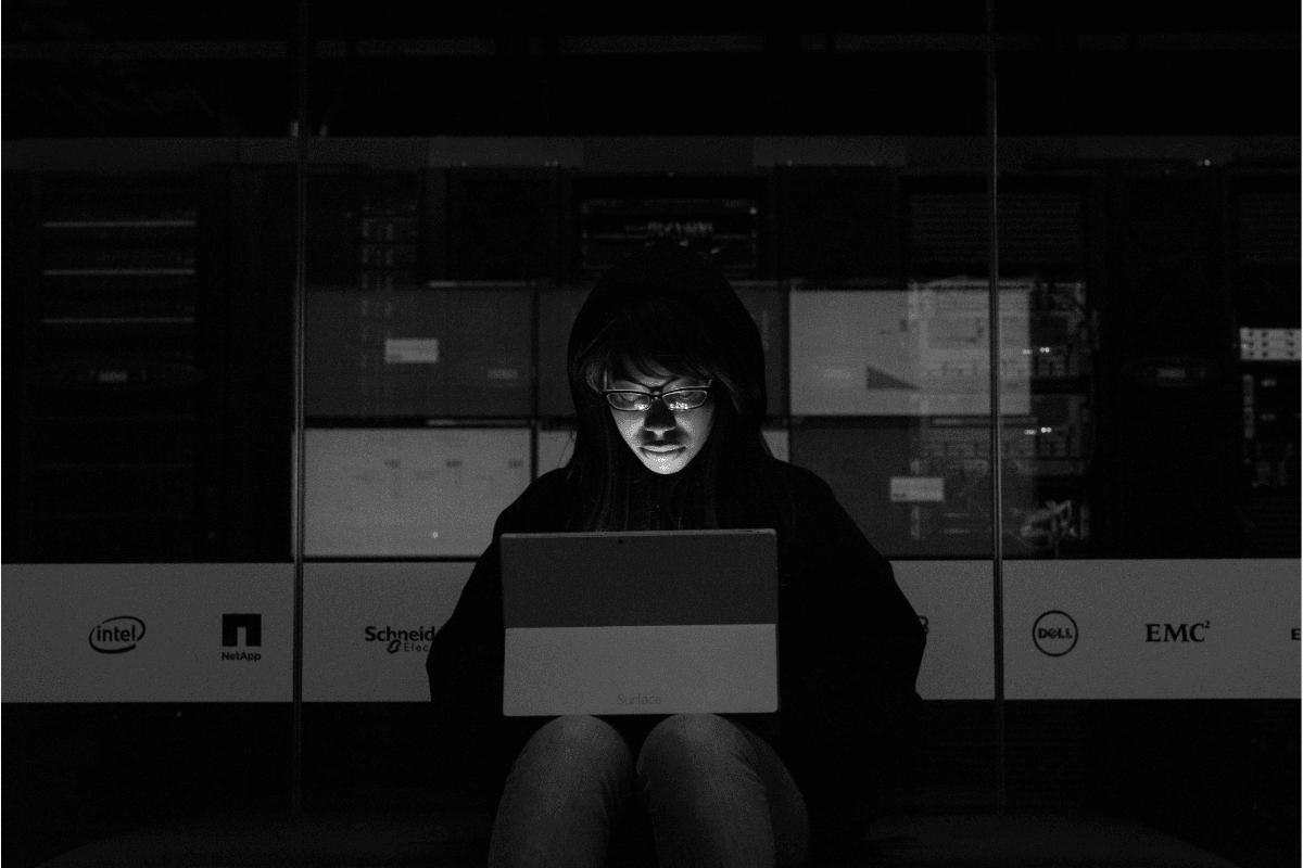 Woman sitting with laptop